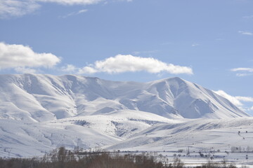 Fototapeta na wymiar The mountains covered with snow