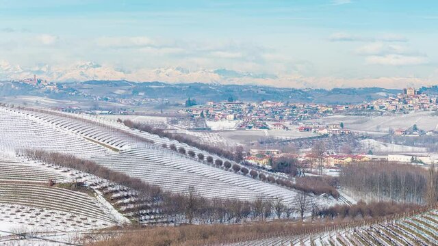 Pan: Italy Piedmont Barolo wine yards unique landscape winter snow, La Morra medieval village castle on hill top, italian historical heritage grape agriculture panoramic view