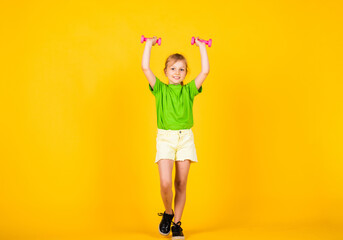pretty teen girl with barbells tools for training, sport