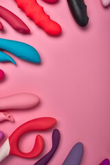 Multi-colored vibrators for female orgasm. Silicone G-spot dildos, sex toys, masturbation devices lie together. time to get some pleasure