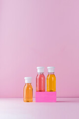 Colored tubes of shower gel. Daily cosmetic product. Empty space for text or logo. Copy space.