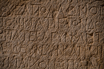 beautiful inscriptions containing curious holes from ruins of Patara