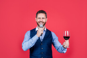 Proposing toast. Toast master speak into microphone lifting glass of wine. Alcohol drink ritual. Drinking tradition. Celebration or honor. Giving speech