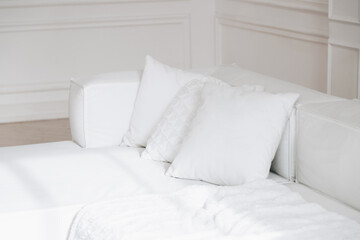 White couch with pillows