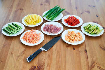 sushi ingredients placed on the wooden table. prepared for sushi making at home