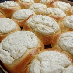 Homemade delicious buns with cottage cheese on a baking sheet
