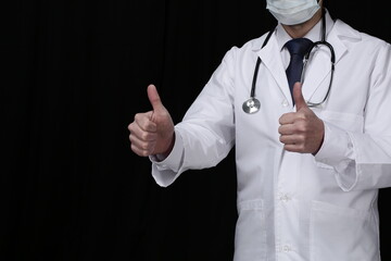 Doctor with stethoscope in protective mask on black background