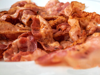 slices of fried bacon close up