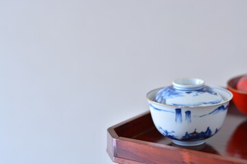 picture rice bowl. put on a Japanese lacquer serving tray. This is a very fine example of Japanese traditional antique “ imari ware ” . blurred background soft focus image. 