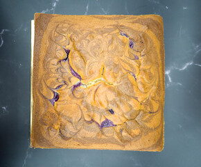 Top view of a whole square blueberry butter cake. Selective focus points