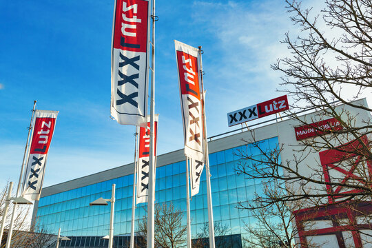Dreieich, Germany - February 20, 2021. Sales building of the furniture company xxxlutz also known as mannmobilia logo