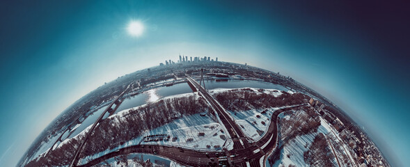Beautiful panoramic winter aerial drone view to Warsaw city center with skyscrapers and Swietokrzyski Bridge (En: Holy Cross Bridge) - is a cable-stayed bridge over the Vistula river in Warsaw, Poland