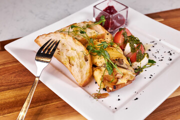 Close-up tasty dish on plate prepared in restaurant or cafe at wooden board. flat lay, copy space