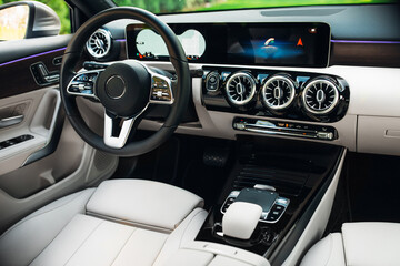 Fototapeta na wymiar Modern car interior with the leather panel, and dashboard