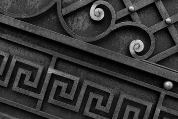 Rustic metal gates with forged elements, home protection in a retro style