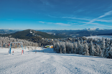 Skiing area in Ukrainian Carpathian in the morning light. Beautiful winter landscape. Nature and sport.