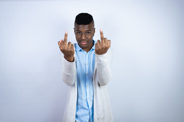 Young handsome african american man wearing casual clothes showing middle finger doing fuck you bad...