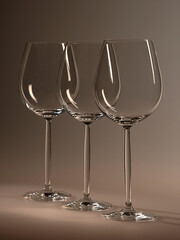 Glass glasses for wine and champagne. Three empty glasses stand diagonally.