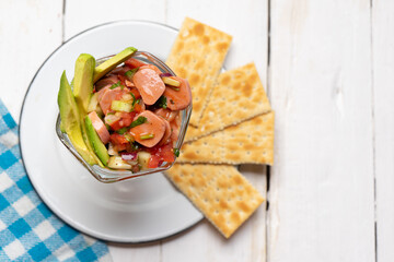 Wieners cocktail with avocado and ketchup on white background. Mexican food