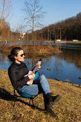 woman playing the ukulele