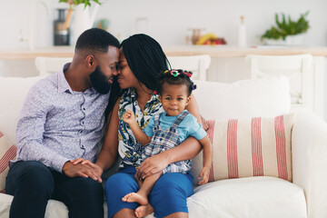 Fototapeta premium happy married couple at home with baby daughter, family relations