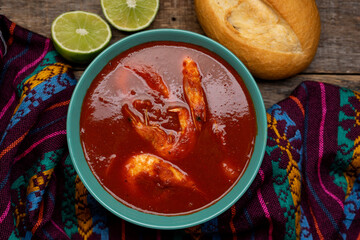 Shrimp soup on wooden background. Mexican food
