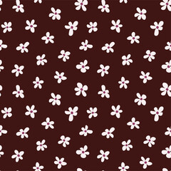 Seamless pattern. Light flowers on a brown background.