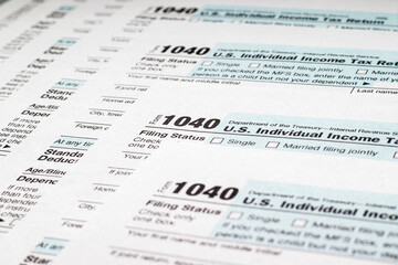Stack of tax forms 1040. Individual income tax return. Selective focus