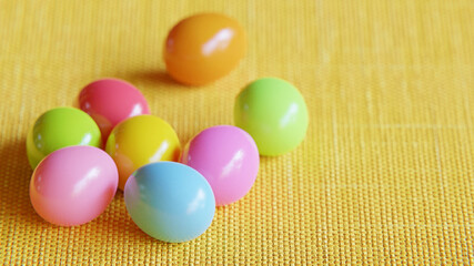Easter eggs on yellow fabric. multicolored easter eggs on a yellow background