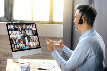 Business meeting online. Successful businessman is negotiating with multiracial business partners...