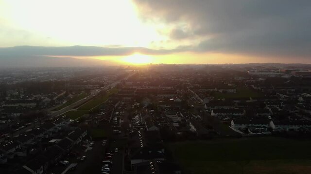 A drone shot of sunset shining over the suburbs of Tallaght.