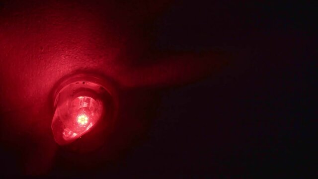Emergency rotating alarm red light at night.