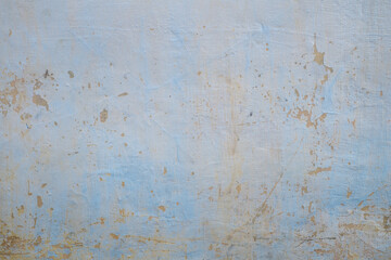 a dull blue wall. caused by hot and rainy weather