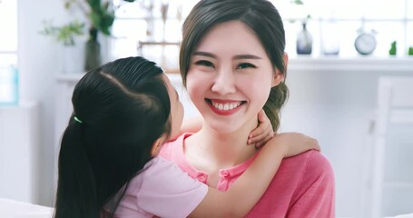 Daughter kiss mom tenderly