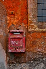 Ancient mailbox on the rustic wall, Ostia, Italy 