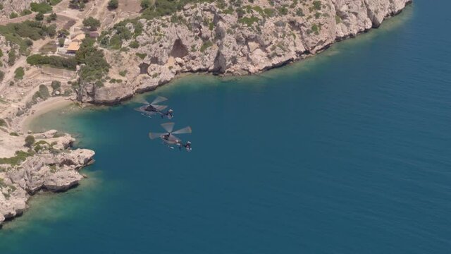 Aerial View of Helicopters Flying Over Ionian Sea Towards Bay and White Cliffs