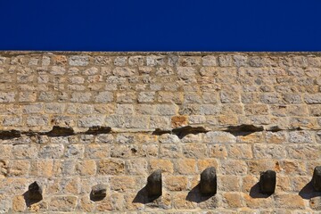 Dubrovnik, Croatia. Ancient wall pattern against blue sky. 