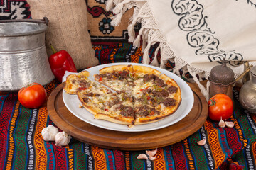 Pizza varieties ready to be served on a white plate.