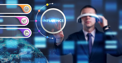 Business, Technology, Internet and network concept. Young businessman working on a virtual screen of the future and sees the inscription: Influence