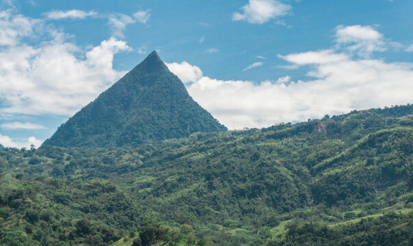 Natural piramid mountain huge in te forest with blue sky