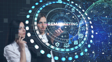 The concept of business, technology, the Internet and the network. A young entrepreneur working on a virtual screen of the future and sees the inscription: Remarketing