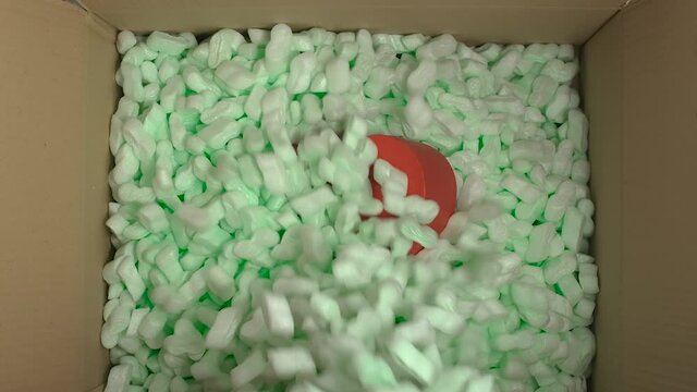 Storyfoam Packing Peanuts Being Poured Falling Into Cardboard Box, Care With Love Heart Box For Customers By Packaging Starch Protective Granules . Online Shopping Retailer