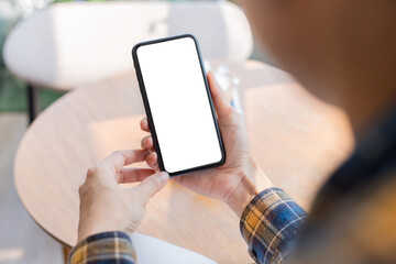 cell phone blank white screen mockup.woman hand holding texting using mobile on desk at office.background empty space for advertise.work people contact marketing business,technology