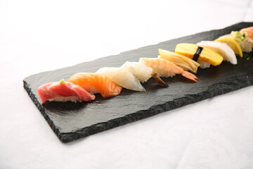 Colorful sushi on a neat background. 깔끔한 배경에 정갈하게 있는 알록달록 초밥