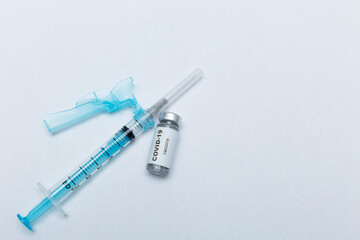 Syringe and vaccine, COVID-19 immunizer, hope for humanity.
