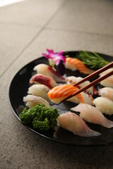 a plate with colorful assorted sushi 알록달록한 모둠 초밥이 담긴 접시