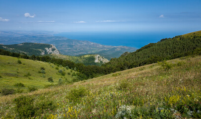 View of the Black Sea coast from the valley of the Demerdzhi mountain range in Crimea.
