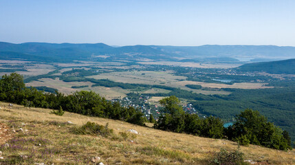 Fototapeta premium Mediterranean landscape. Forested rocks of the Black Sea coast of the southern coast of the Crimean Peninsula on a clear sunny day.