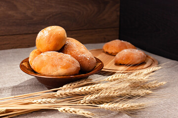 homemade pies with wheat ears on a burlap, proper food