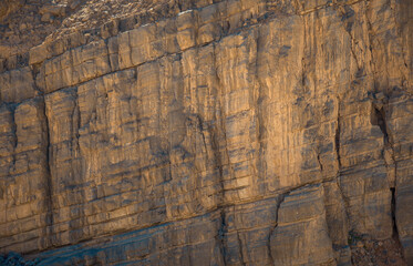 Naklejka premium Mountain side with carved rock and stones - Jebel Jais mountain Ras Al Khaimah, UAE